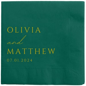 May include: A green paper napkin with the text "Olivia and Matthew 07.01.2024" in gold lettering.