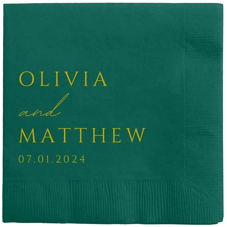 May include: A green paper napkin with the text "Olivia and Matthew 07.01.2024" in gold lettering.