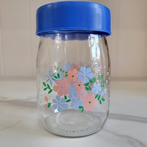 Glazen bus uit de jaren 80 met bloemenprint en blauw deksel, gemaakt in de VS