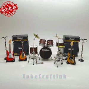 May include: Miniature musical instrument set featuring a red guitar, an orange guitar, a yellow guitar, a drum set with a Yamaha logo, two Marshall amplifiers, and two microphones. The set includes cymbals and drumsticks.