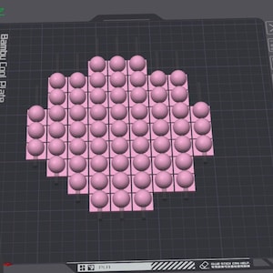 May include: A digital 3D model displayed on a Bambu Cool Plate interface, featuring a grid of light pink spheres arranged in a cross-like pattern. The layout consists of multiple rows and columns of spheres, each resting on a small square base.