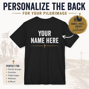 May include: A black short-sleeved t-shirt featuring the white text YOUR NAME HERE centred on the back, with a small gold cross icon below the text. A gold circular badge in the top right corner displays silhouettes of people and the text NAMES, DATES, GROUPS Welcome!