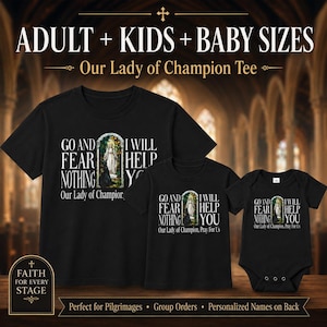 May include: Three black garments including a t-shirt and a baby bodysuit, each featuring a graphic of Our Lady of Champion in an archway with the text: GO AND FEAR NOTHING I WILL HELP YOU. The text Our Lady of Champion, Pray For Us is below.