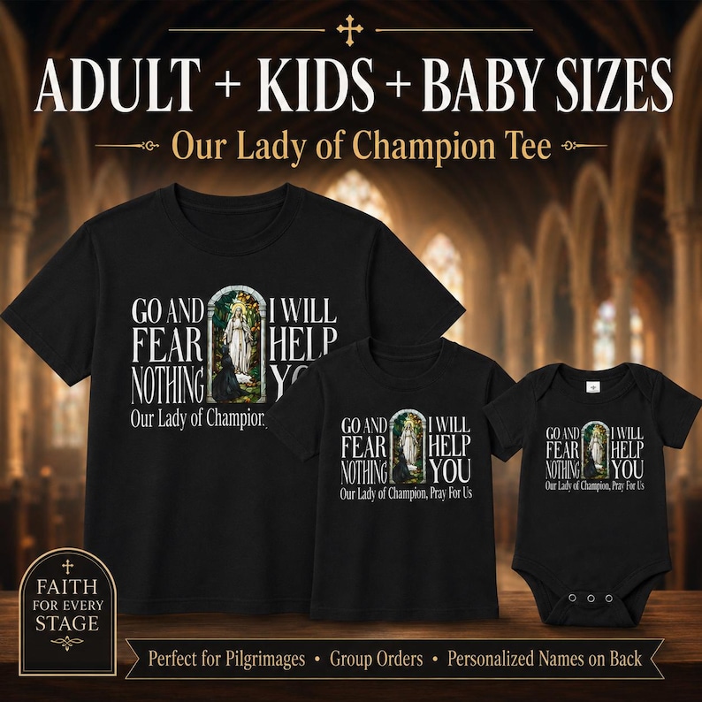 May include: Three black garments including a t-shirt and a baby bodysuit, each featuring a graphic of Our Lady of Champion in an archway with the text: GO AND FEAR NOTHING I WILL HELP YOU. The text Our Lady of Champion, Pray For Us is below.