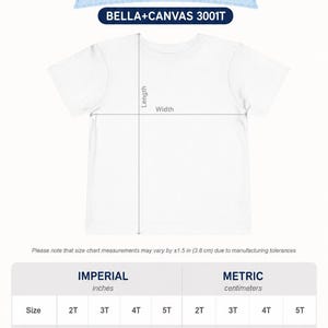 May include: A white toddler t-shirt size chart for Bella+Canvas 3001T. The graphic displays a t-shirt outline with length and width arrows. A table provides measurements in centimetres for sizes 2T, 3T, 4T, and 5T, noting a 3.8 cm tolerance.