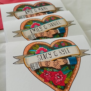 May include: Three white rectangular cards featuring a heart-shaped illustration with a banner. The banner displays names including Amy & Mark, Emily & Daniel, and Stacy & Kyle. The design includes two hands shaking, red roses, and green leaves.