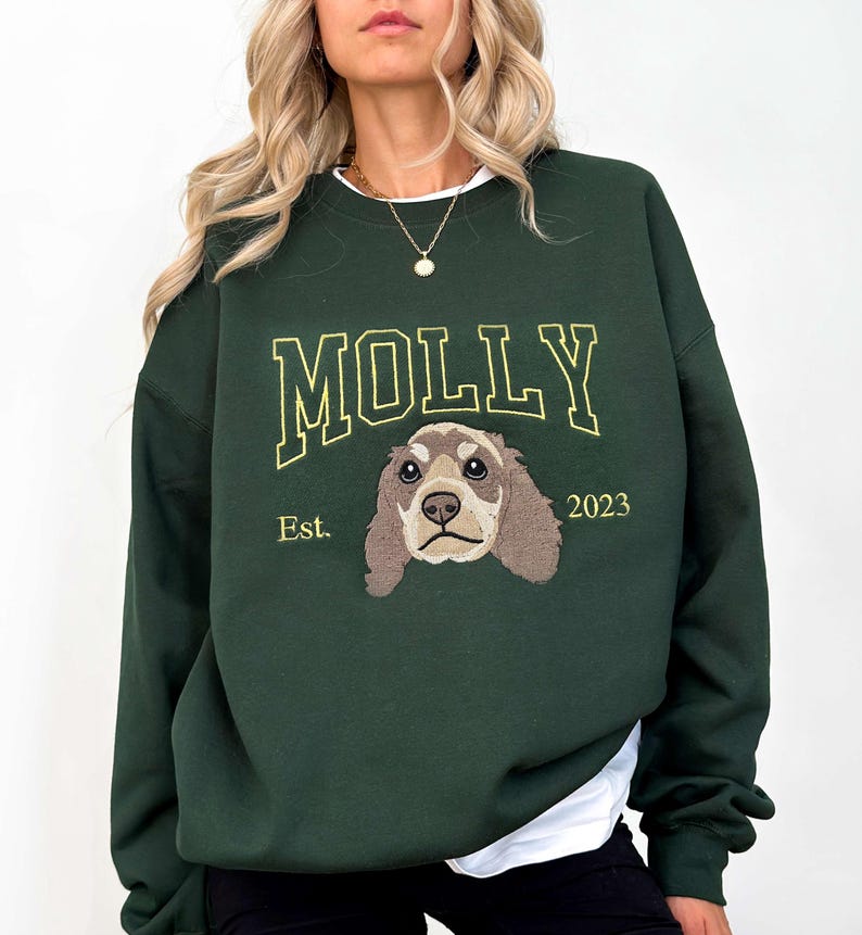 Custom Embroidered Dog Name Hoodie shown in dark green.