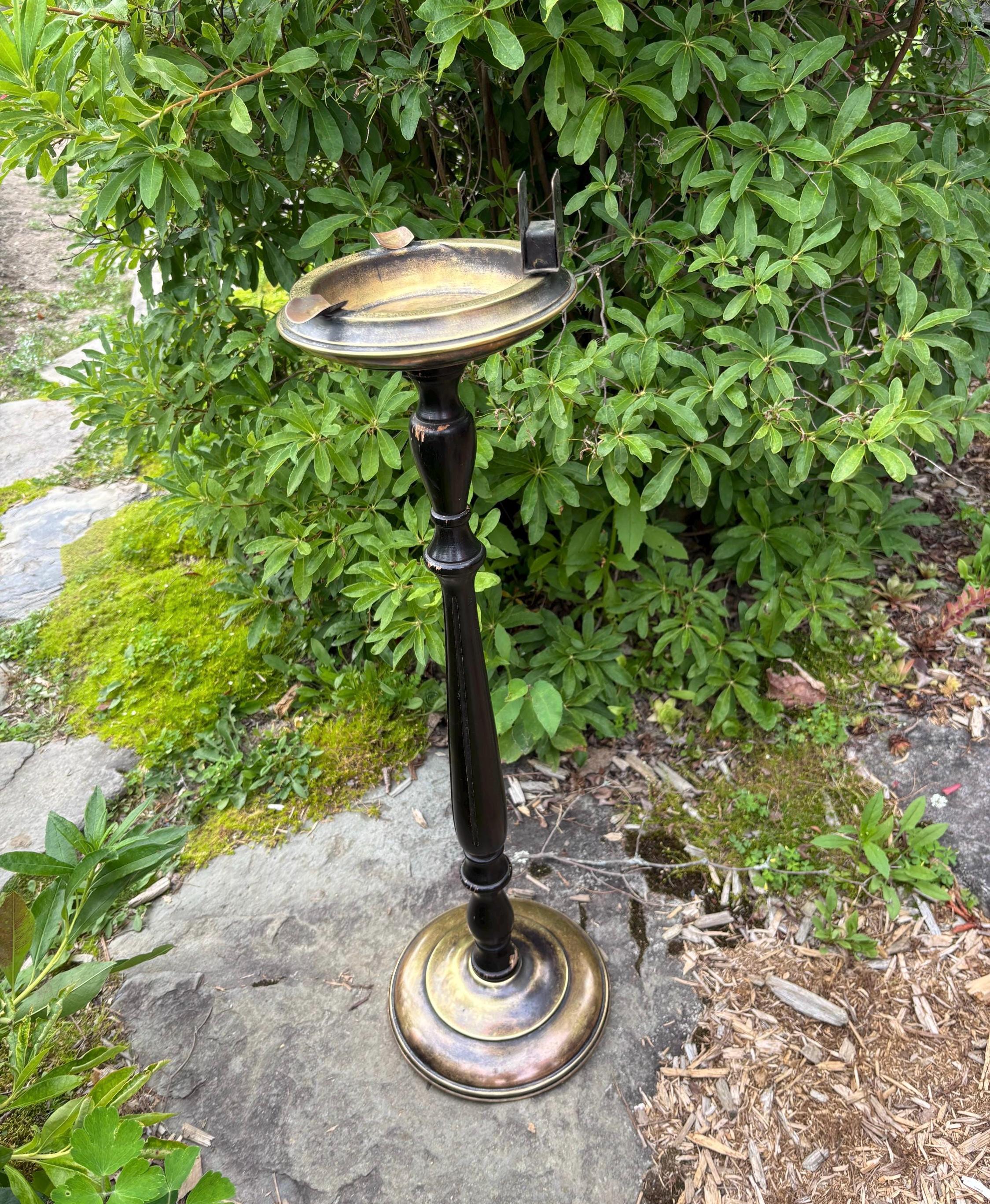 Vintage brass and wood standing ashtray. 27in high. Chipped see photo