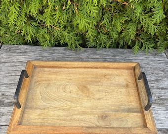 Rustic wooden serving tray with iron handle. Made in India.