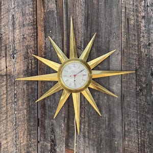 Ingraham Mid Century Starburst Uhr / goldfarbene 1960er Jahre elektrische Uhr.