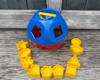 Jogo de brinquedo Tupperware Shape-O para aprendizagem de formas, destreza e números, vintage, azul, vermelho, amarelo, bola de plástico redonda, básica para pré-escola, combinação.