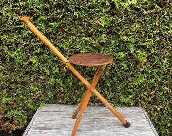 Lightweight folding cane seat.