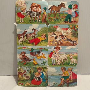 May include: A set of eight vintage illustrated cards depicting children interacting with farm animals. The cards are colourful and feature a variety of animals, including cows, horses, goats, ducks, sheep, and deer. The cards are in good condition and would be a great addition to any collection.