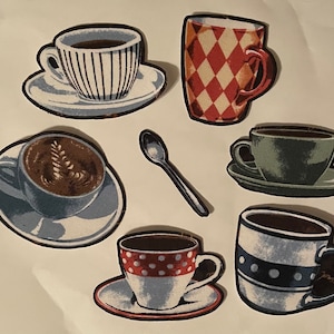 May include: Six different coffee mugs with various designs. The mugs are on a white background. The mugs are all different colours and patterns. One mug has a red and white checked pattern, another has a blue and white polka dot pattern, and another has a brown and white floral pattern.