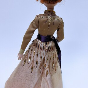 This Anna doll has a small fortune of "gems" on her gown.  The only doll that comes even close is Saks Fifth Avenue's doll with 2 stones on her gown.  My Anna doll has Crystal Rhinestones *all over* her gown---and costs 1/3 as much!