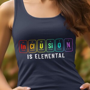 May include: Navy blue tank top with the phrase "INCLUSION IS ELEMENTAL" in white text. The word "INCLUSION" is spelled out using the periodic table of elements in rainbow colors. A casual, comfortable top.