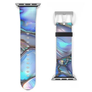 May include: Two watch bands with a pearlescent design in shades of blue, purple, and silver. The bands have silver-colored hardware. The watch bands are designed to fit a smartwatch.