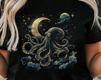 May include: A black t-shirt with a graphic print of an octopus in a starry night sky with a crescent moon and a planet. The octopus has gold accents.