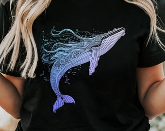 May include: A black t-shirt with a blue and purple whale graphic. The whale is stylized with intricate details and swirls.