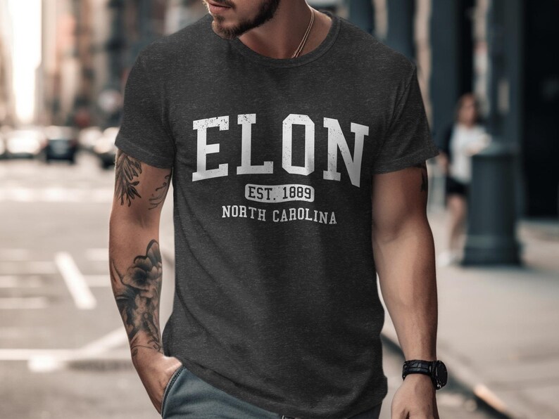 Dark gray t-shirt with "ELON EST. 1889 NORTH CAROLINA" in white text.