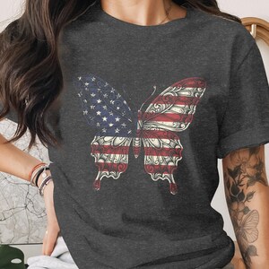 Dark gray t-shirt with an American flag butterfly graphic.