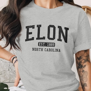 Grey t-shirt with "ELON EST. 1889 NORTH CAROLINA" text.