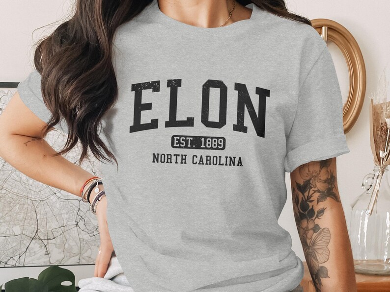 Grey t-shirt with "ELON EST. 1889 NORTH CAROLINA" text.