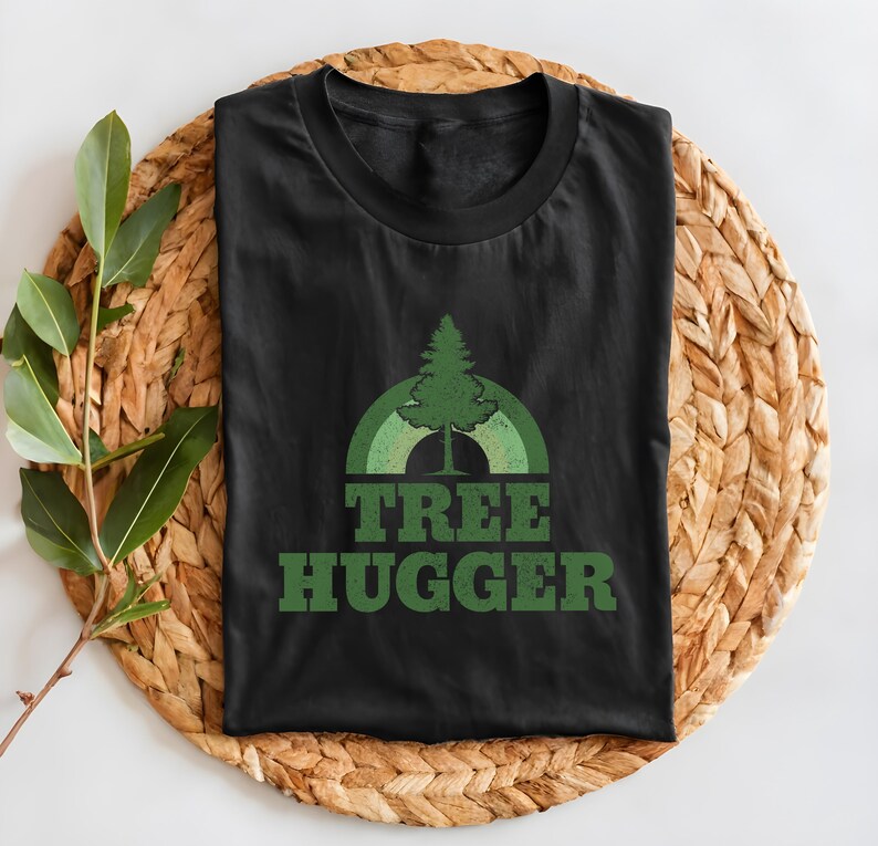 May include: Black t-shirt with a green tree graphic and the text "TREE HUGGER" in green.