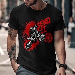 Black t-shirt with "SEND IT" text and a distressed graphic of a motocross rider.