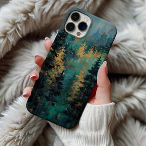 May include: A smartphone case featuring a forest scene with teal, gold, and dark green hues. The case has a glossy finish and a detailed painting of trees. The case is designed to fit a smartphone.