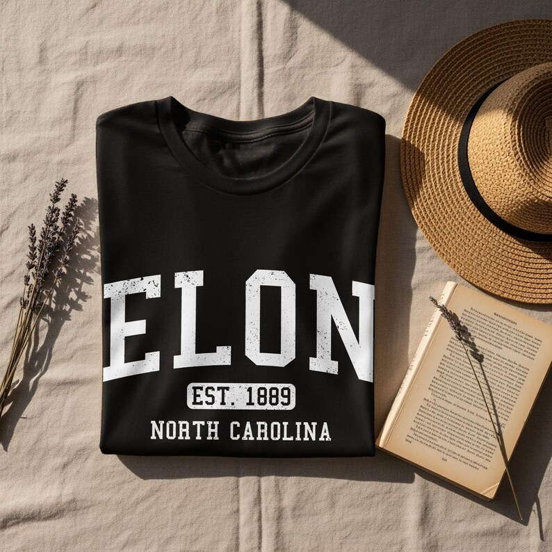 Black t-shirt with "ELON EST. 1889 NORTH CAROLINA" printed in white.