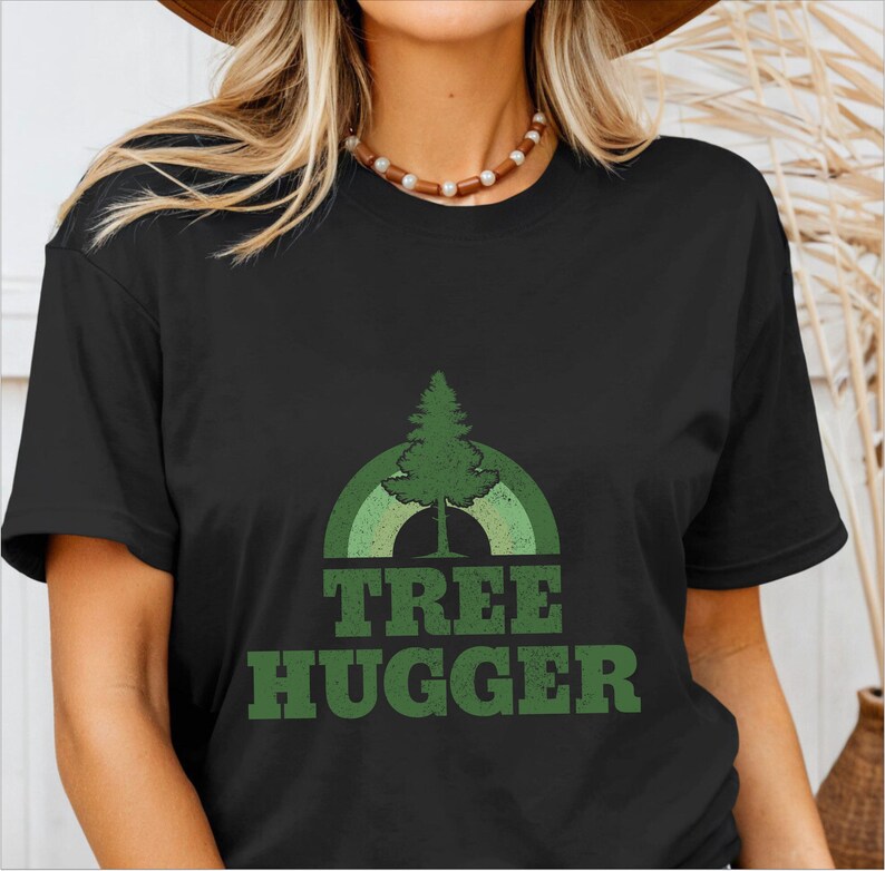 May include: Black t-shirt with a green tree and rainbow graphic and the text "TREE HUGGER" in green.