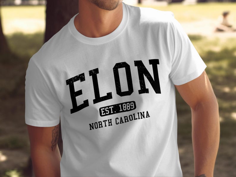 White t-shirt with black text "ELON EST. 1889 NORTH CAROLINA".