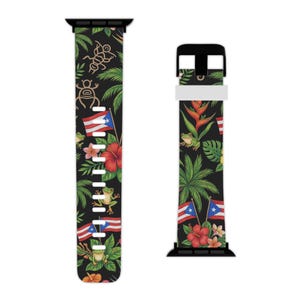 May include: Black watch strap with a tropical design featuring Puerto Rican flags, frogs, hibiscus flowers, and palm leaves. The strap has a black buckle and connectors. The design includes indigenous symbols and vibrant colours.
