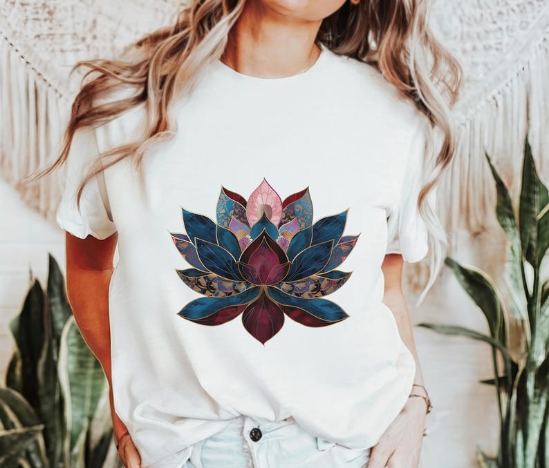 May include: White t-shirt with a colorful lotus flower graphic. The flower is made up of blue, purple, pink, and gold tones.