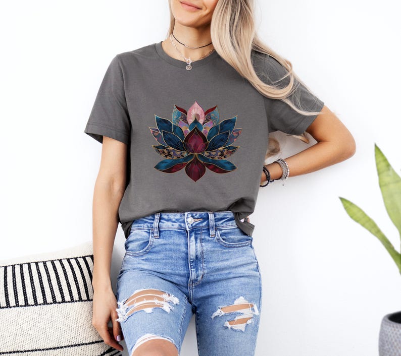 May include: A charcoal grey t-shirt with a colorful geometric lotus flower design. The lotus flower is made up of shades of blue, pink, and burgundy.