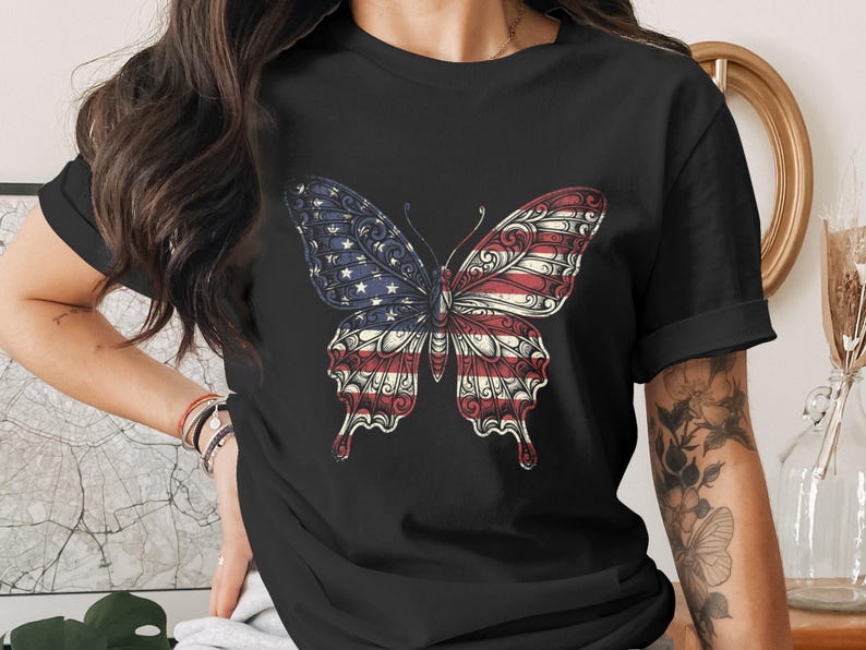 Black t-shirt featuring a butterfly with U.S. flag wings.