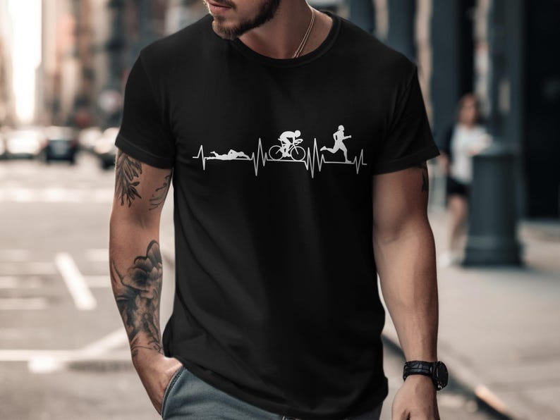 Black t-shirt with white triathlon icons on a heartbeat line.