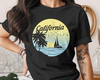California Distressed Sunset Beach Unisex T-Shirt: Retro Palm Tree Sailboat Graphic