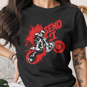 Black t-shirt with "SEND IT" and a motocross rider graphic.