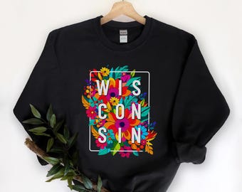 May include: Black sweatshirt with a colorful floral design and the word "WISCONSIN" in white letters.
