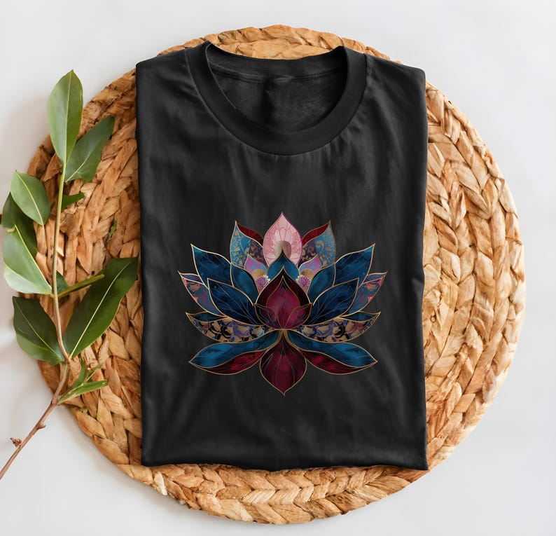 May include: Black t-shirt with a colorful lotus flower design. The flower is made up of different shades of blue, purple, pink, and red. The flower is outlined in gold.