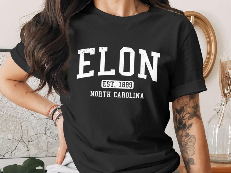 Black t-shirt with "ELON EST. 1889 NORTH CAROLINA" in white text.