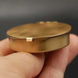 Customizable small round brass pillbox or trinket box.  Personalize with an engraving and/or 3D vintage brass stamping art for the lid.  Extensive designs to choose from including insects, animals and celestial themes!