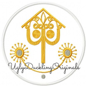 May include: A white circle with a gold outline and a gold design in the centre. The design features a stylised tree with two circles on each side. The text "Ugly Duckling Originals" is written in gold at the bottom of the circle.