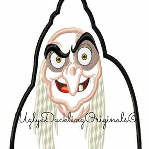 May include: A black and white embroidery design of a witch's face with a pointed hat and long white hair. The design includes the text "Ugly Duckling Originals".