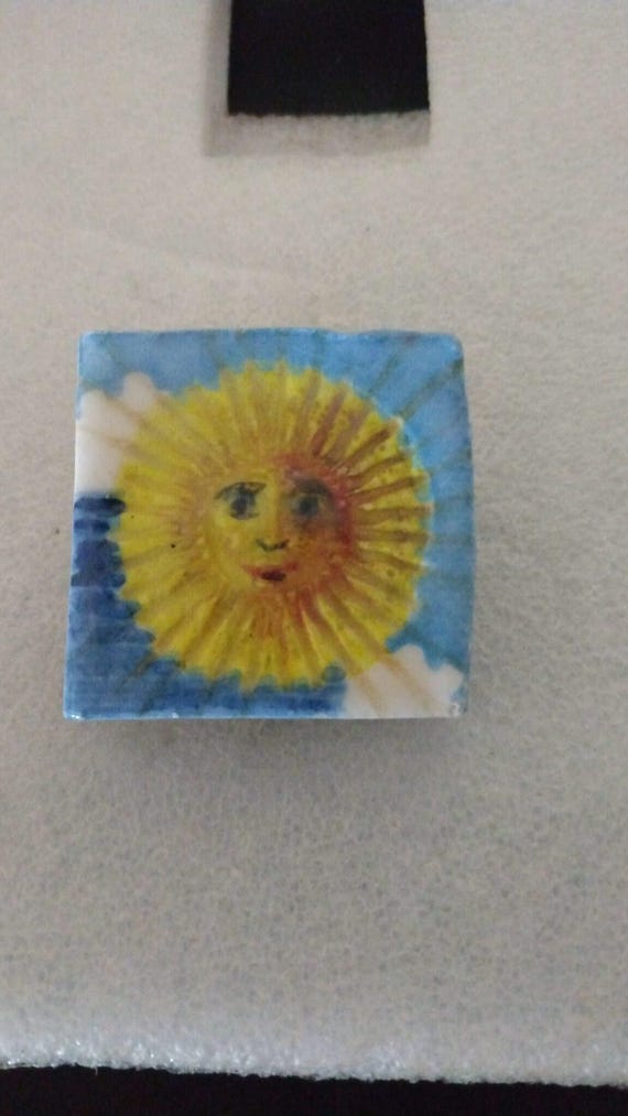 Handmade ceramic sun brooch