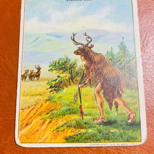 May include: A vintage illustration of a person dressed as a deer stalking other deer in a forest clearing. The image is titled "Stalking Deer" and is copyrighted 1910 by Amer. Tob. Co.
