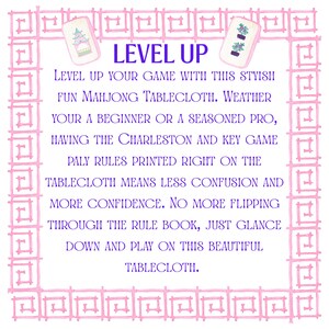 May include: A white Mahjong tablecloth with a pink border and the words "LEVEL UP" in blue. The tablecloth includes the Charleston and key game rules. Two Mahjong tiles are shown in the upper corners.