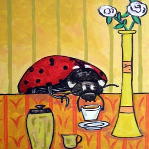 May include: A red and black ladybug sits at a table with a cup of coffee and a teapot. There is a vase with white flowers in the background.